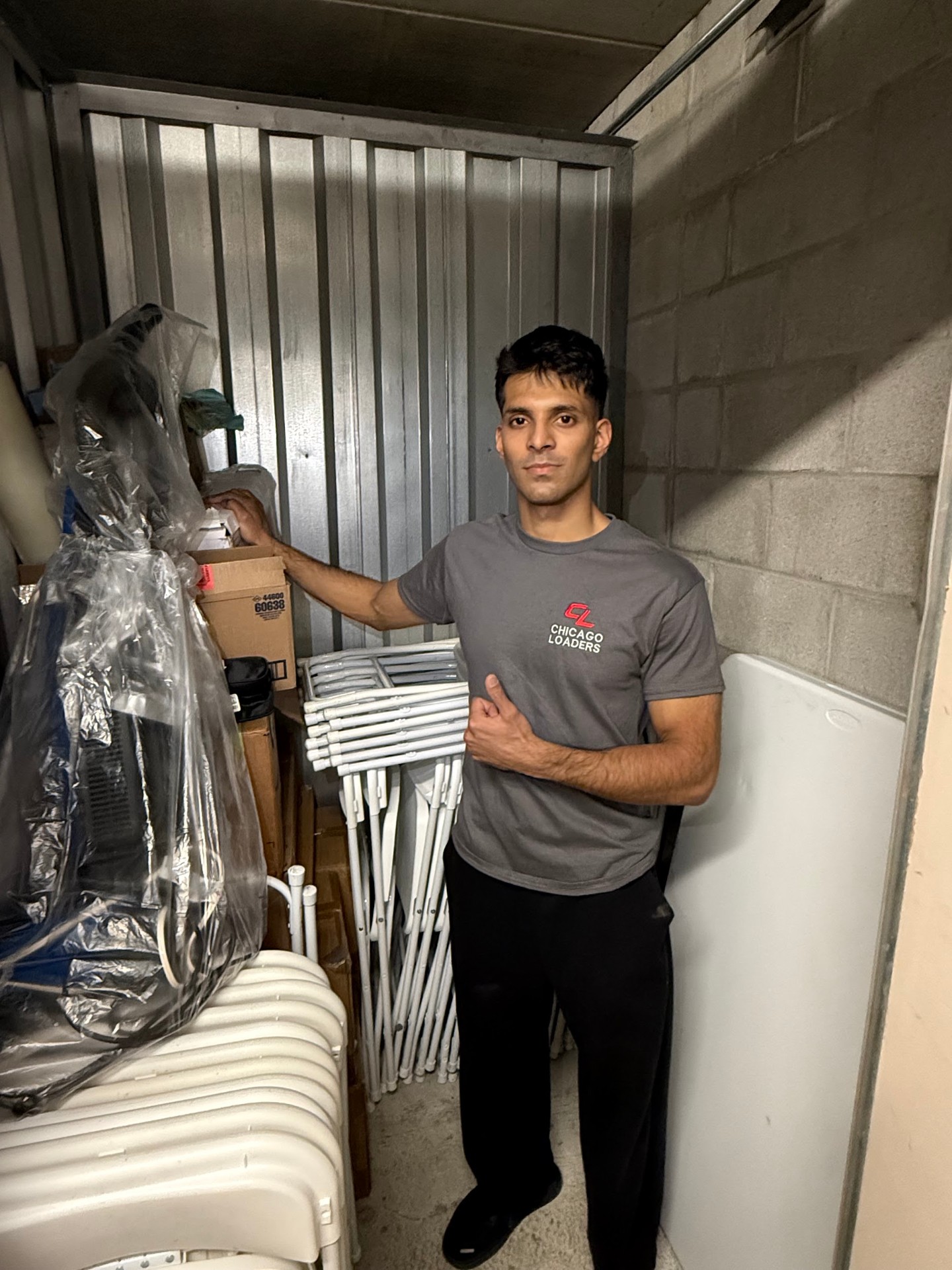Loader organizing items inside a storage unit