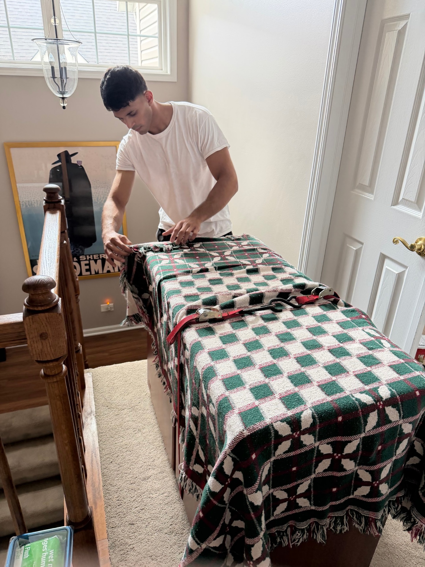 Chicago Loaders crew member wrapping and strapping furniture inside a home